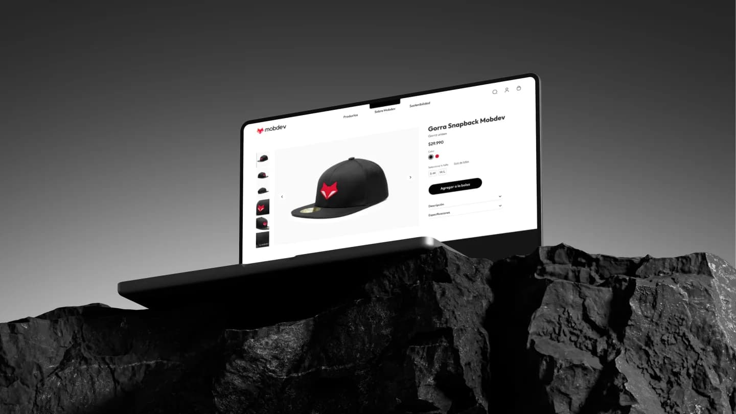 Macbook en una roca con fondo negro